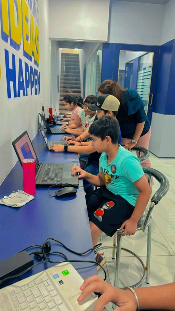 Kids coding class at Techno Tykes, children learning computer programming in a fun educational environment.